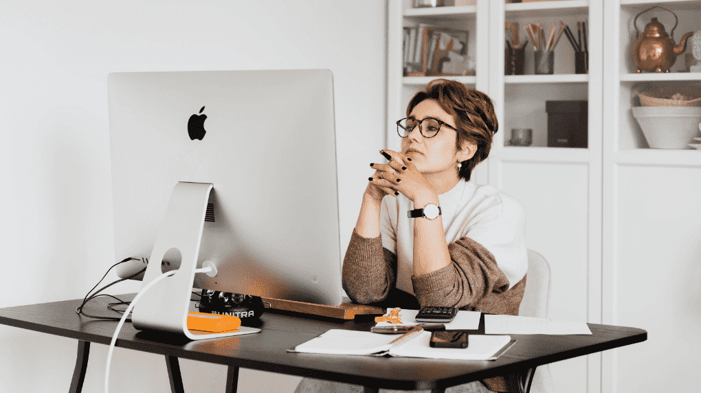 woman strategizing at desk