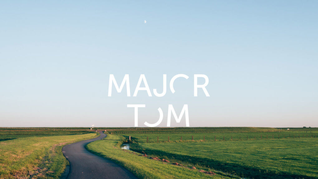 Major Tom logo over an image of a field