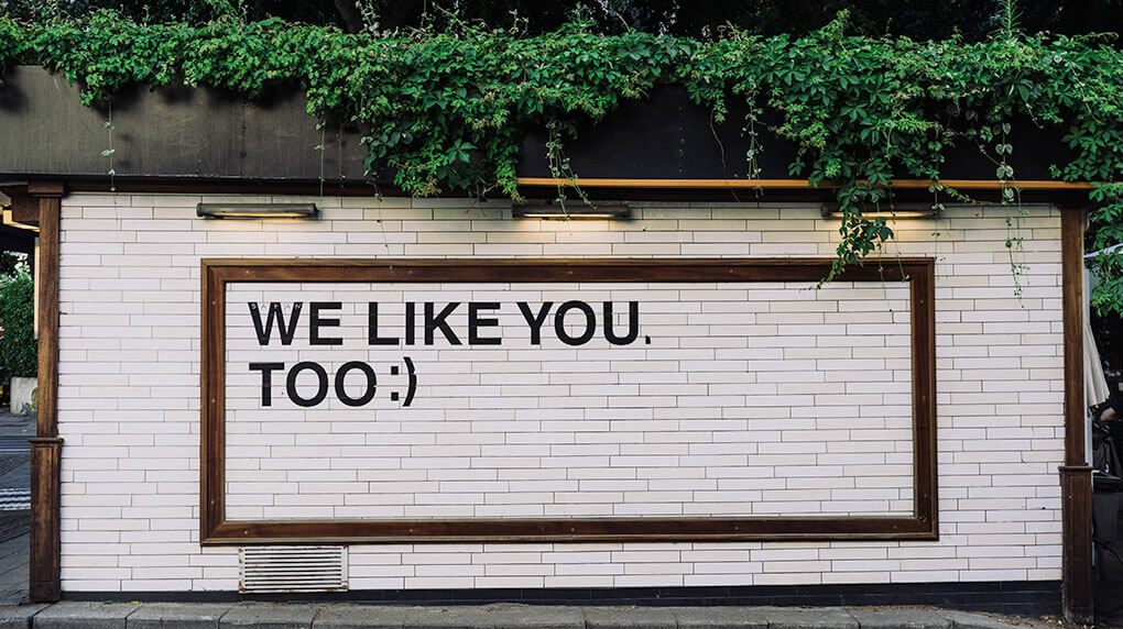 Message on a wall that says We like you too