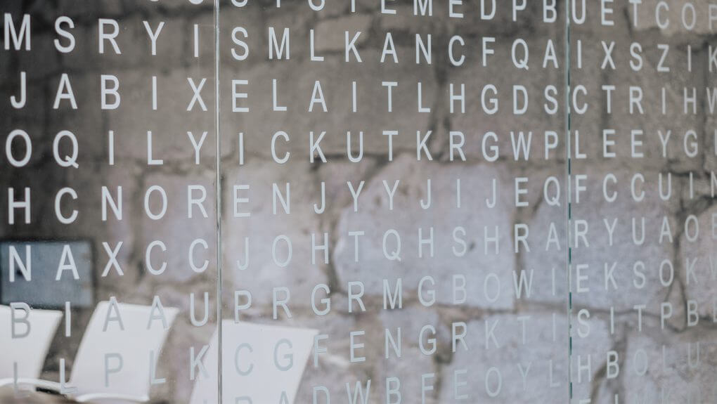 crossword image on the glasswall at Major Tom office