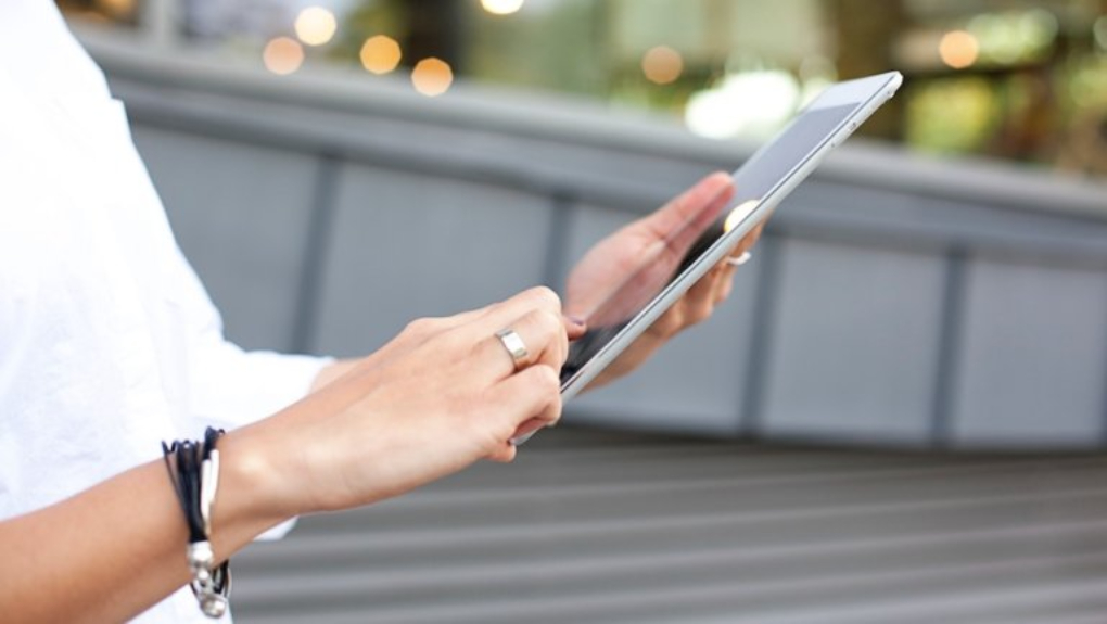 person writing on tablet