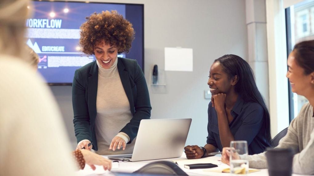 pregnant woman leading meeting