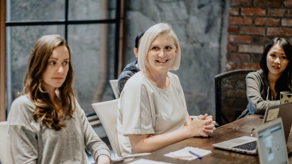 members of the Major Tom Vancouver office sitting around a table