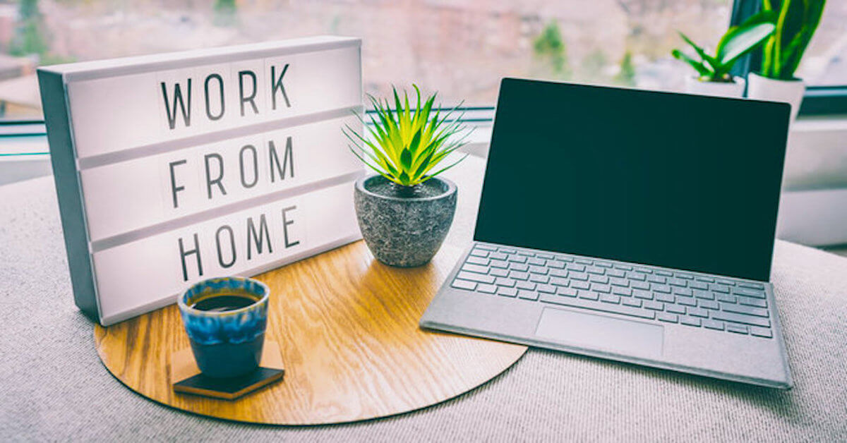 work from home light up box on desk next to laptop